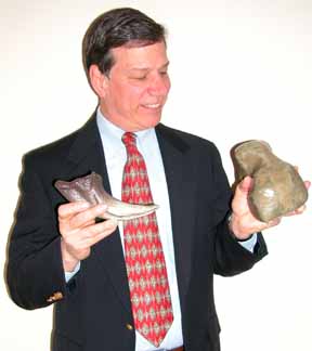 Photo of Bob Knopf w/dinosaur claw replica